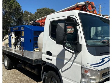 2006 STERLING FLATBED TRUCK WITH PUTZMEISTER CONCRETE PUMP TK70